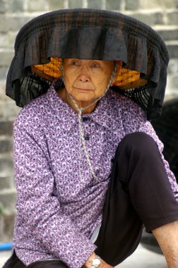 A Hakka old woman in Kat Hing Wai of Hong Kong clipart