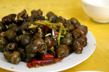 Spicy snails in Chinese style clipart