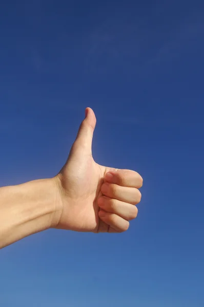 stock image Thumbs up in blue sky