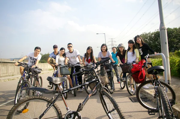 Asian friends riding bicycle — Stock Photo, Image