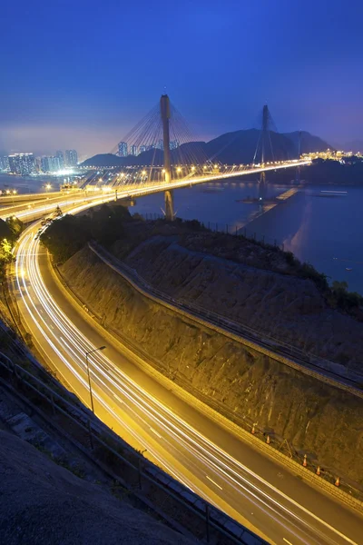 Ting Kau Bridge at night along the highway in Hong Kong
