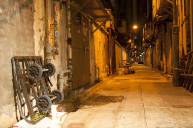 Old alley in Hong Kong at night clipart