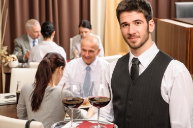 Waiter hold wine glasses business lunch restaurant clipart