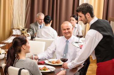 Business lunch waiter serving red wine clipart