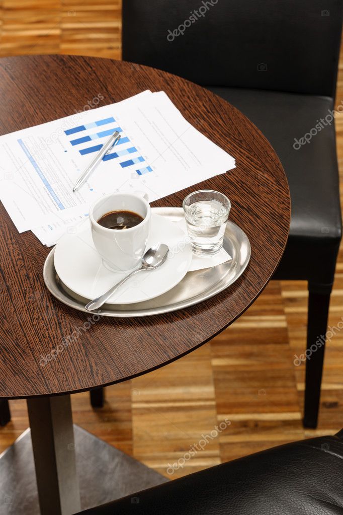 Coffee break business table with reports charts