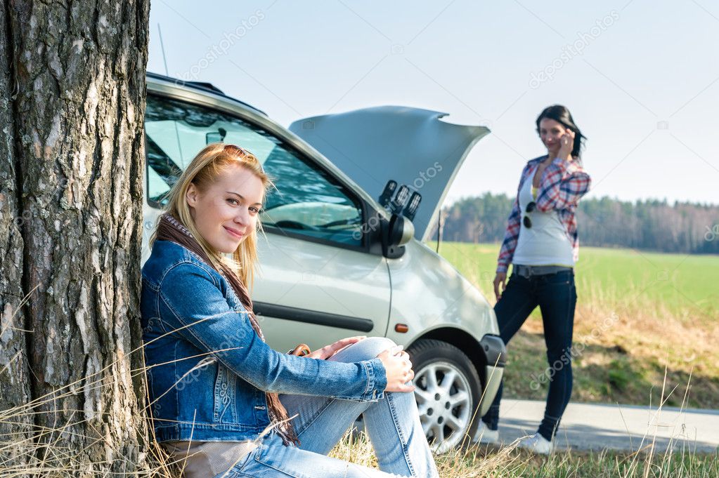 Car defect two women waiting for help
