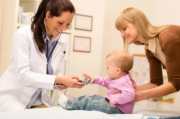Pediatrician examine baby with stethoscope Stock Photo