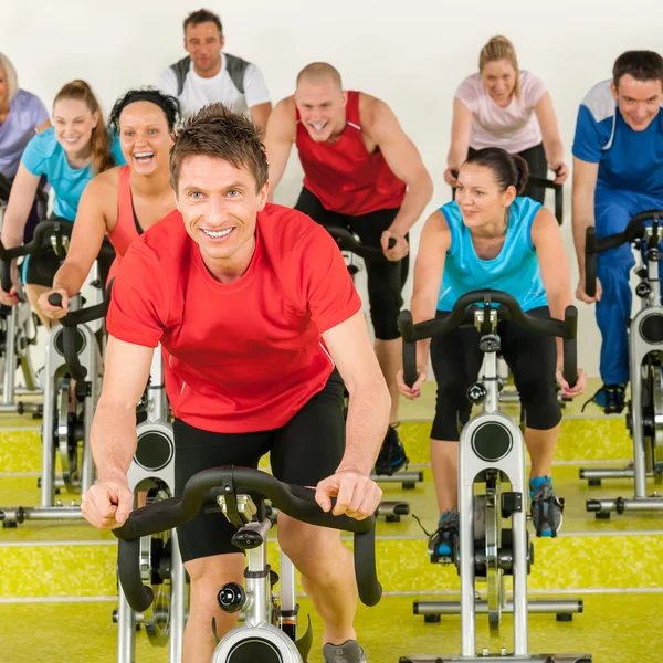 Fitness instructor with spinning class — Stok fotoğraf