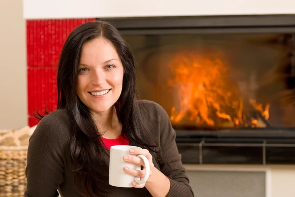 Winter home fireplace woman drink hot coffee — Stock Photo, Image