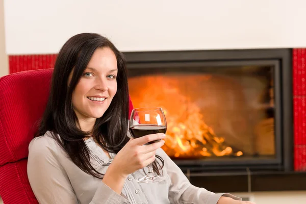 Winter home fireplace woman glass red wine — Stock Photo, Image