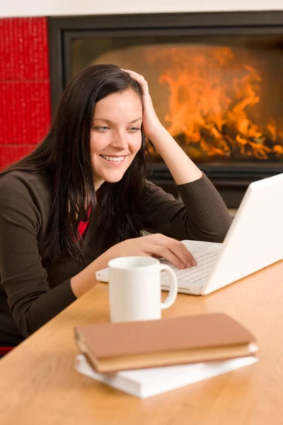 Home living woman with laptop by fireplace — Stock Photo, Image