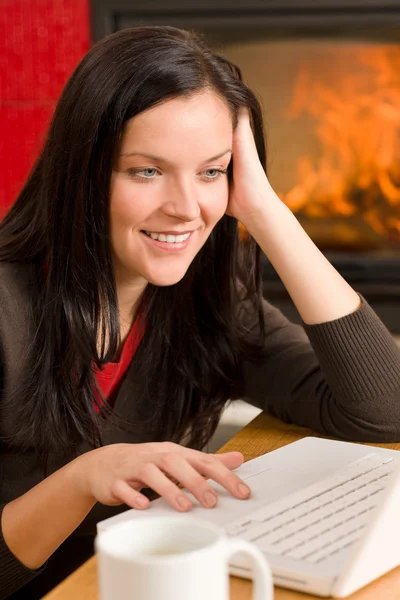 Home living woman with laptop by fireplace — Stock Photo, Image