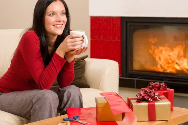 Christmas present wrap woman drink home fireplace — Stock Photo, Image