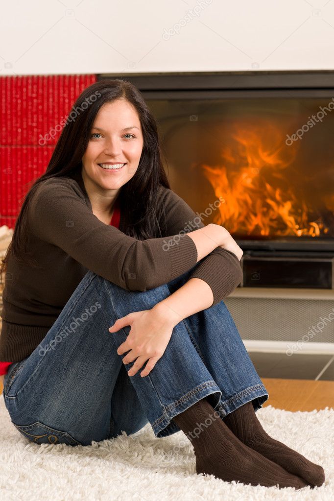 Home fireplace happy woman relax warm up