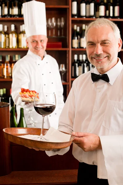 Chef cook with tapas on tray restaurant — Stock Photo, Image