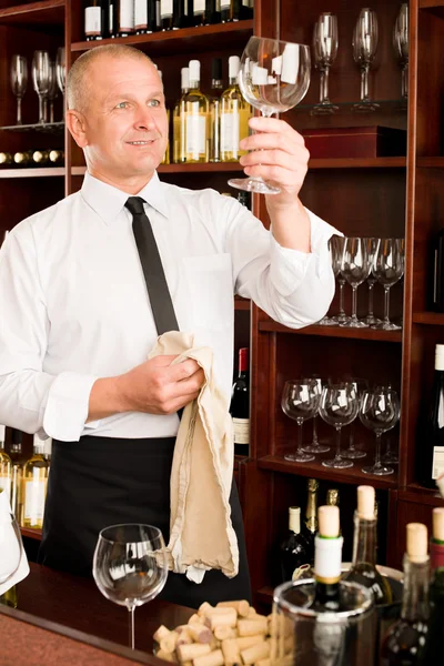 Wine bar waiter clean glass in restaurant Stock Image