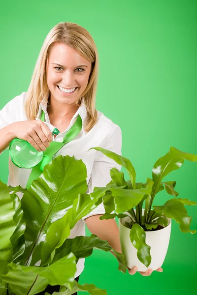 Green business woman water houseplant smiling — Stock Photo, Image