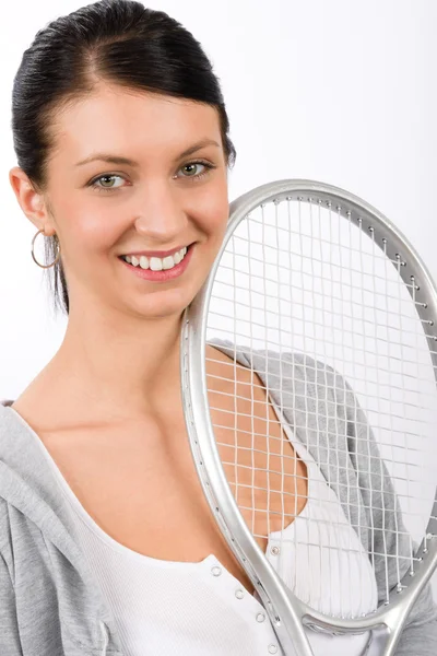 Tennisspielerin junge lächelnde Frau hält Schläger in der Hand — Stockfoto
