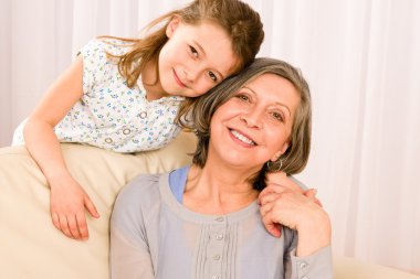 Grandmother with young girl smile relax together clipart