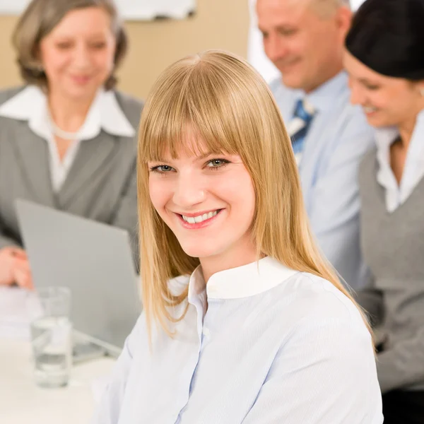 Businesswoman at team meeting with colleagues — Stock Photo, Image