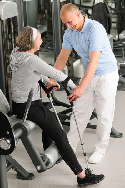 Senior woman with help of physiotherapist — Stock Photo, Image