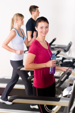 Young woman on fitness running belt clipart