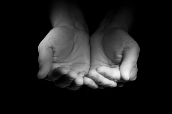Hands ask the charity from foto watcher — Stock Photo, Image