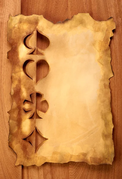 Papel velho sobre textura de madeira marrom — Fotografia de Stock