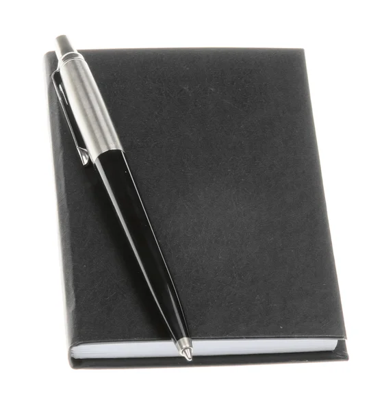Notebook és a toll elszigetelt — Stock Fotó