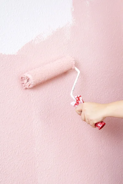 Stock image Painting a wall in pink