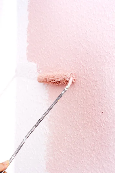 Stock image Painting a wall in pink