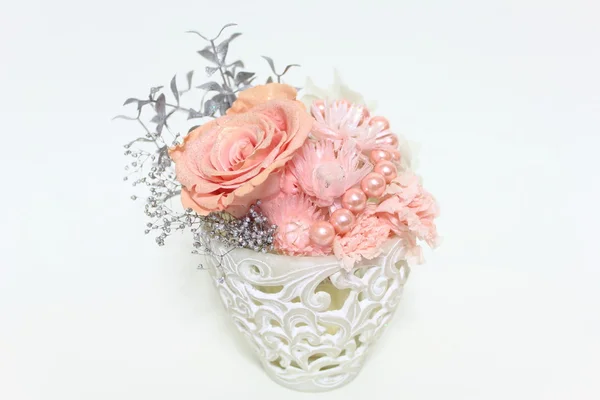 Flower arrangement of a pink diamonds rose Royalty Free Stock Images