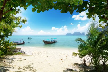 Long boat on Phi Phi island in Thailand clipart