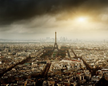 Eiffel tower in Paris and stormy sky clipart