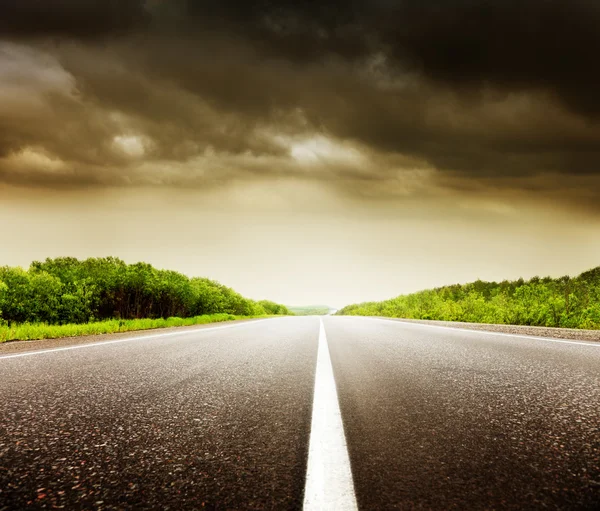 stock image Road and cloudy sky