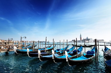 Gondolas on Grand Canal and San Giorgio Maggiore church in Venic clipart