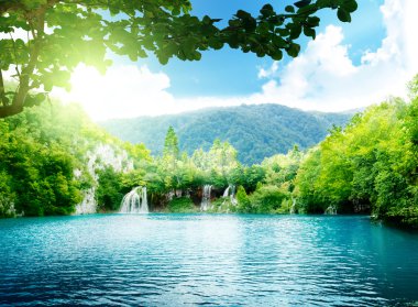 Lake in deep forest clipart