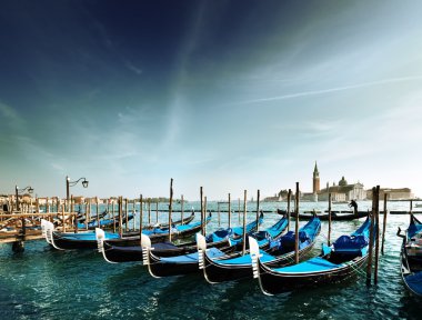 Gondolas on Grand Canal and San Giorgio Maggiore church in Venic clipart