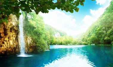 Waterfall in deep forest clipart
