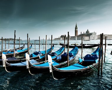 Gondolas on Grand Canal and San Giorgio Maggiore church in Venic clipart