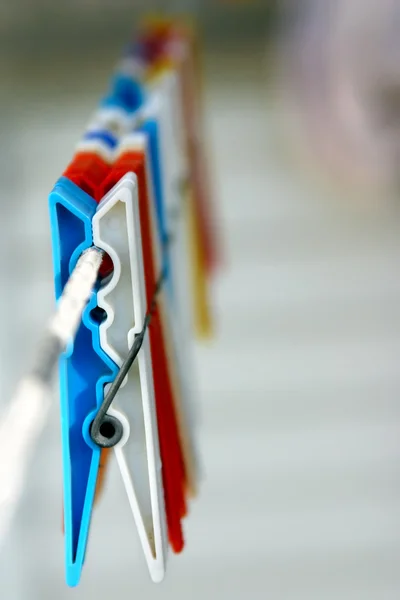 stock image Colorful clothespins on a string