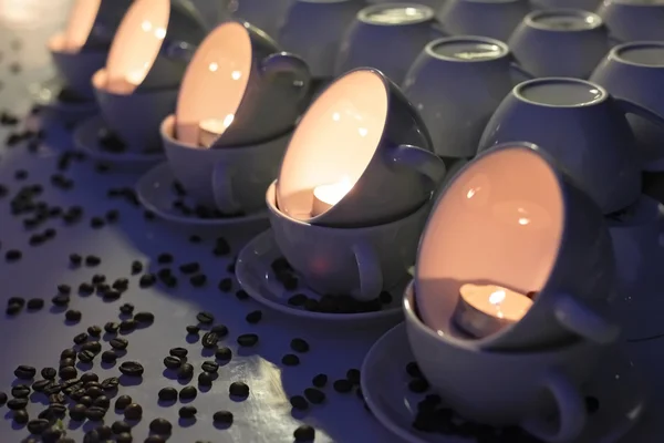 stock image Candles in white cups with coffee beans dotted