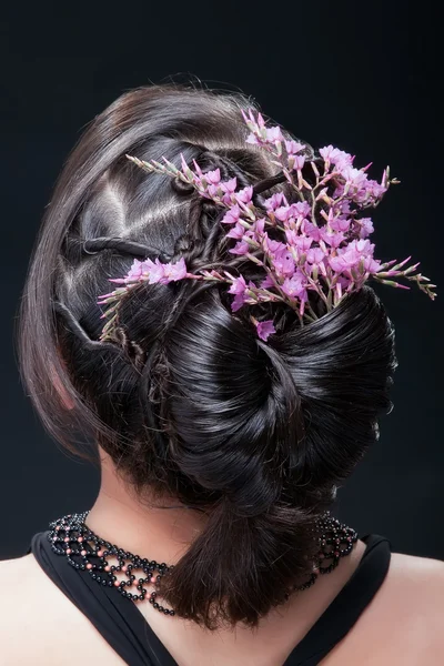 stock image Evening hairstyle with flowers.