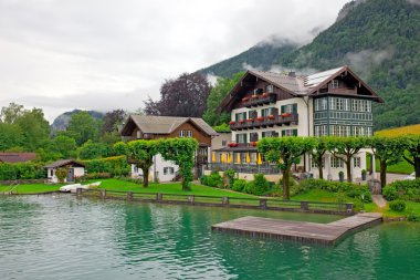 The beautiful house on the lake Wolfgangsee Austria (Village St. clipart