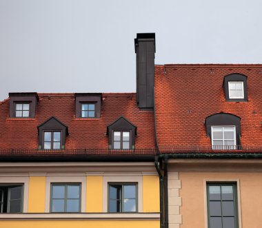 Close-up of houses with red tile roof in Munich, Germany clipart