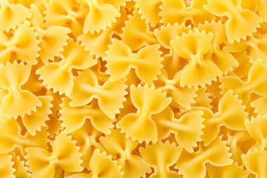 Farfalle pasta texture background. clipart