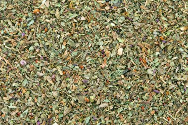 Ground dried Basil (Sweet Basil) background. clipart