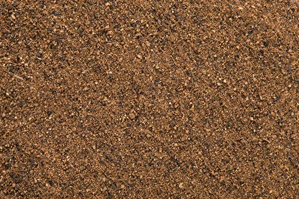 Muskotnöt pulver (myristica fragrans) bakgrund. — Stockfoto