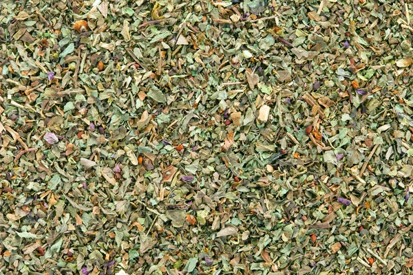 Ground dried Basil (Sweet Basil) background. — Stock Photo, Image
