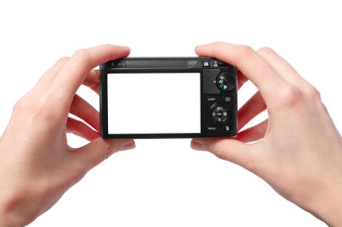 Closeup image of two hands black compact digital photo camera wi clipart